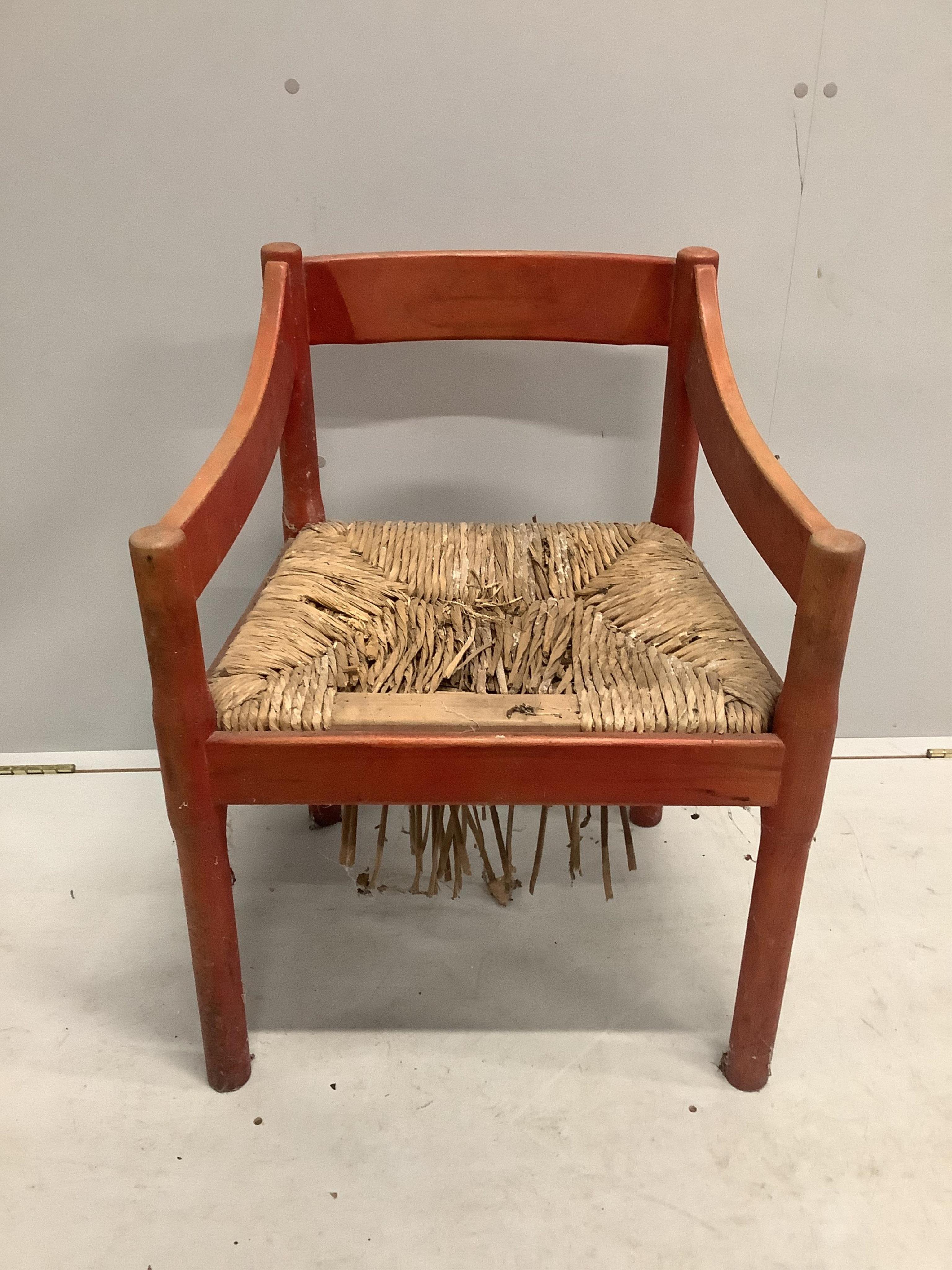 An early Habitat Magistretti style red stained beech settee, width 198cm, depth 84cm, height 69cm and a matching elbow chair. Condition - poor to fair